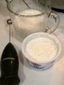 Add fresh yogurt to scalded and cooled milk